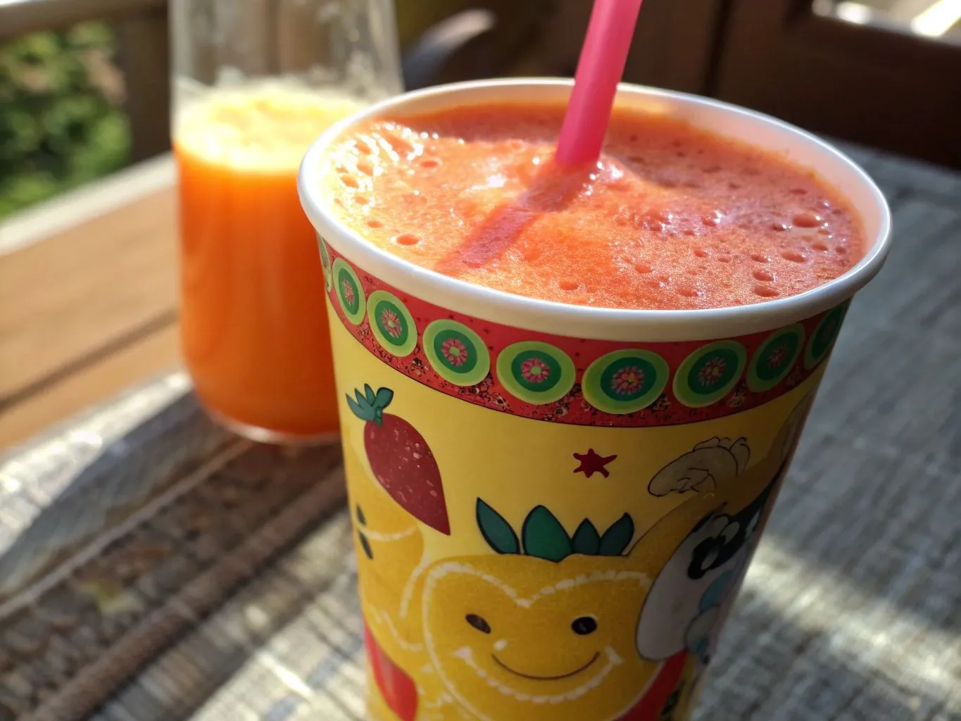 Quick and Easy Juice Recipes for Busy Mornings 7 Bright, playful juice cups with colorful straws filled with freshly blended fruit and veggie juices for kids.